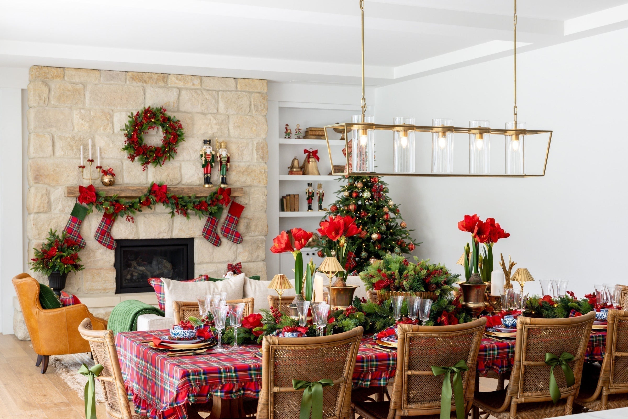 Traditional Christmas dining table with Christmas tree and garland in background.