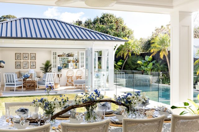 Coastal spring look with white furniture and pool house