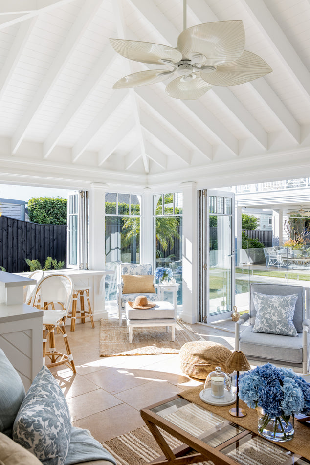 Coastal Pool house with two Indira Armchairs, Indira footstool, Oak Coffee table, St Tropez bar stools, and various Raffia decor
