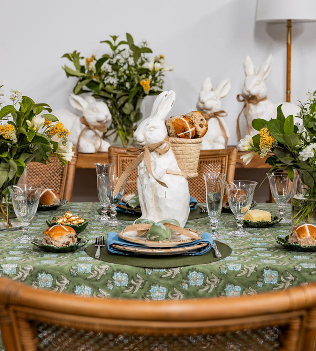 Easter Dining Table with Floral Laya Napery, Bunnies Decorated, and Hot Cross Buns on Bread Plates
