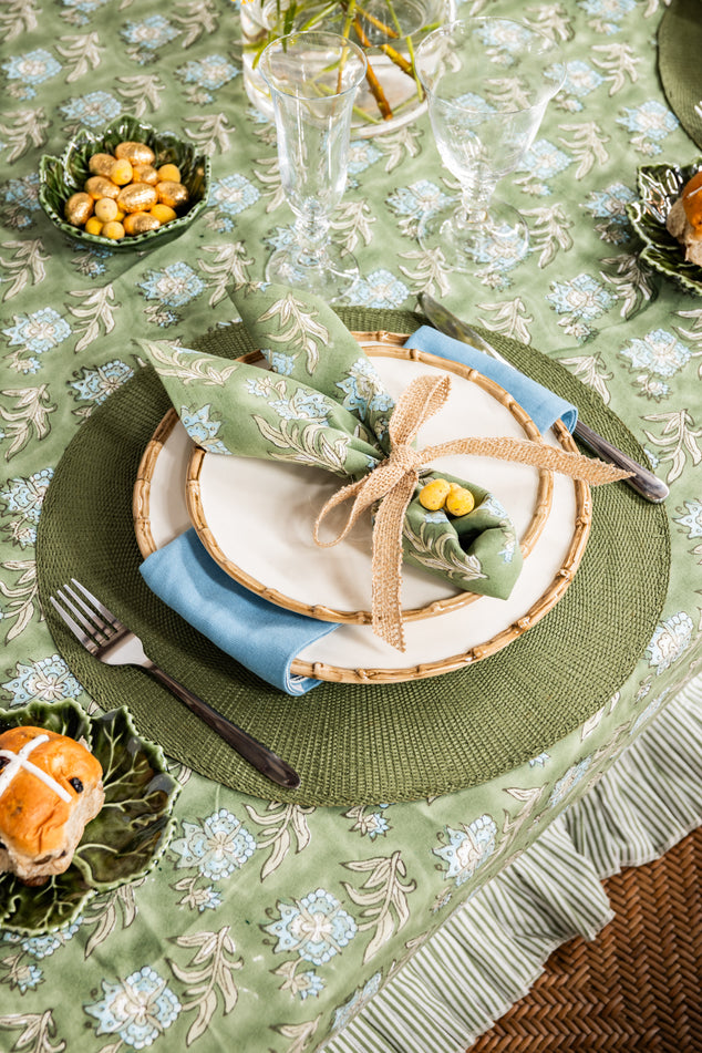 Easter Table Setting with Green Floral Laya Napery, Bamboo Dinnerware, and Mini Chocolate Easter Eggs