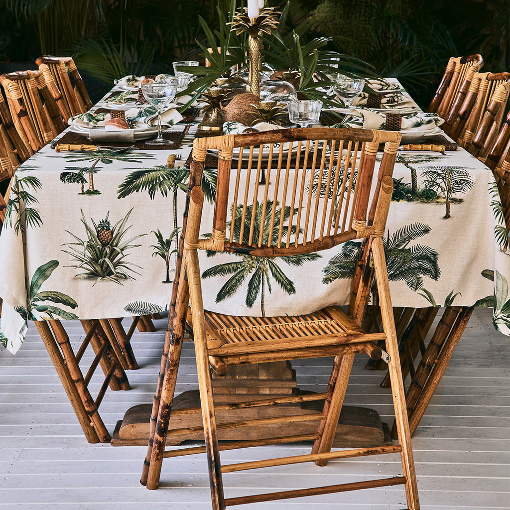 bamboo folding chairs around a table on outside deck