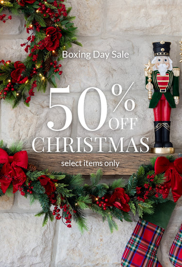 50% off Christmas - Decorated Christmas mantle with Nutcracker, wreath and garland.