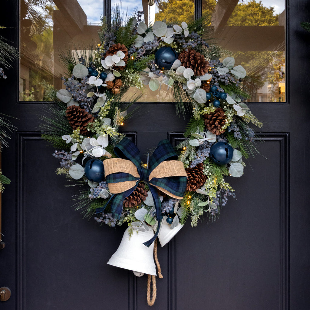 Newport blueberry wreath with white bells on a blue door.