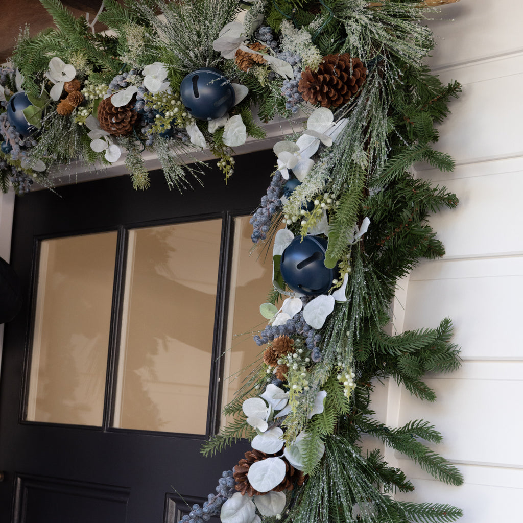 Blueberry garland wrapped around a blue door.