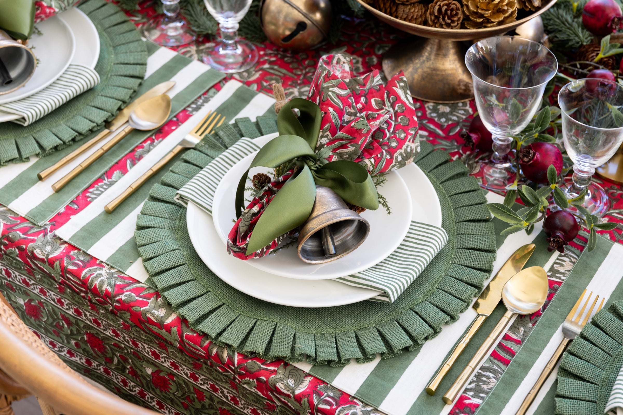 Christmas Dining table with Festive Rose Napkins and Green Ribbon 