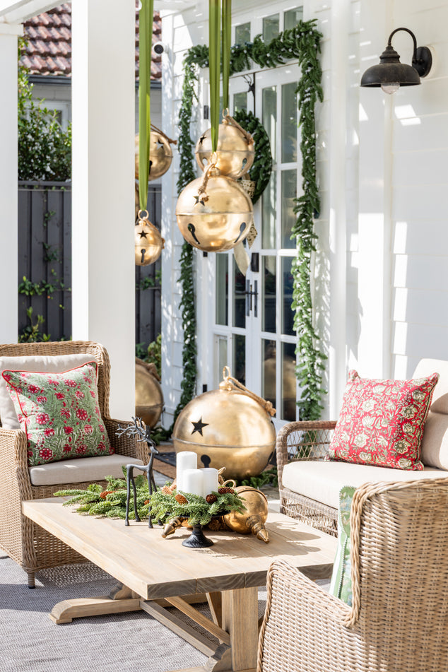 outdoor Lounge styled for Christmas with Cushions and Christmas Decor on Coffee Table