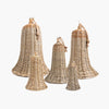 Five natural woven rattan bell-shaped decorative ornaments in assorted sizes, arranged on a plain light gray background.