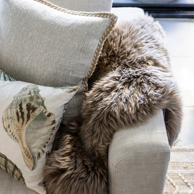 Taupe Sheepskin Rug 105cm Styled On Sofa