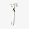 Decorative hook with deer head design on a white background