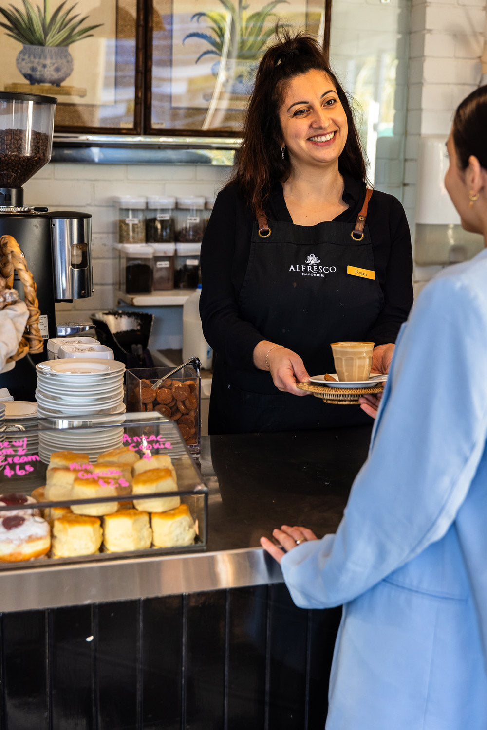 A customer getting a coffee at the Alfresco Emporium cafe