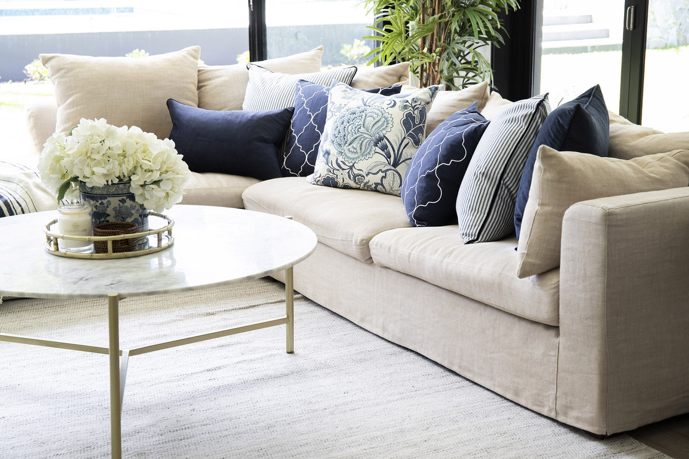 Blue & white cushions on a lounge