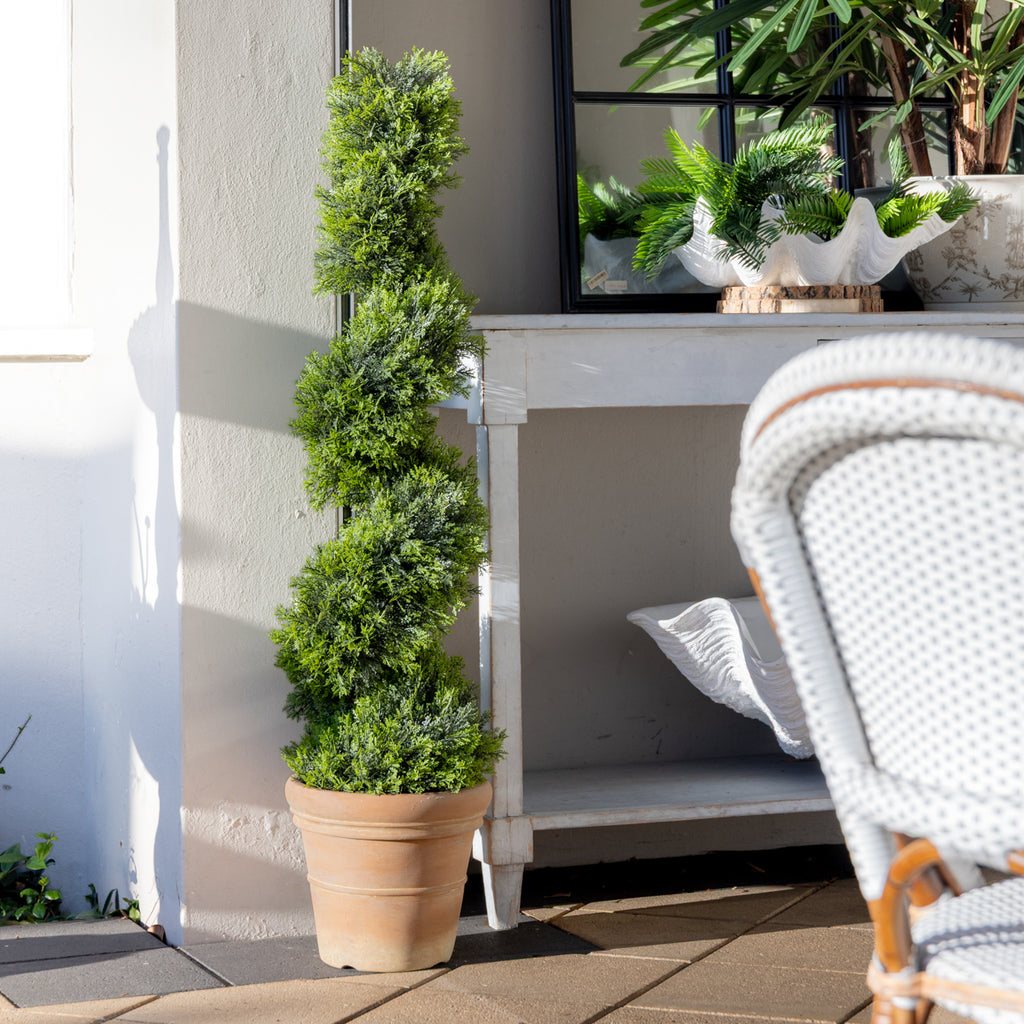 Artificial Cypress Topiary 132cm Styled Outside Next to Console with Florals on it