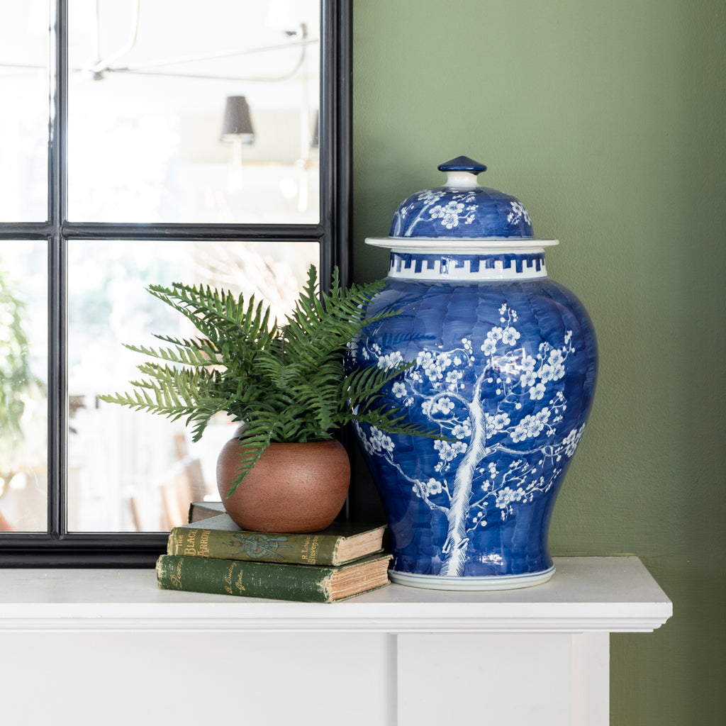 Artificial Fern Arrangement 26cm Styled on Mantle with Blue Vase and Books