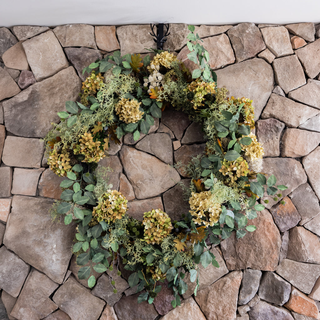 Artificial Green Hydrangea Wreath 109cm STYLED ON STONE WALL 
