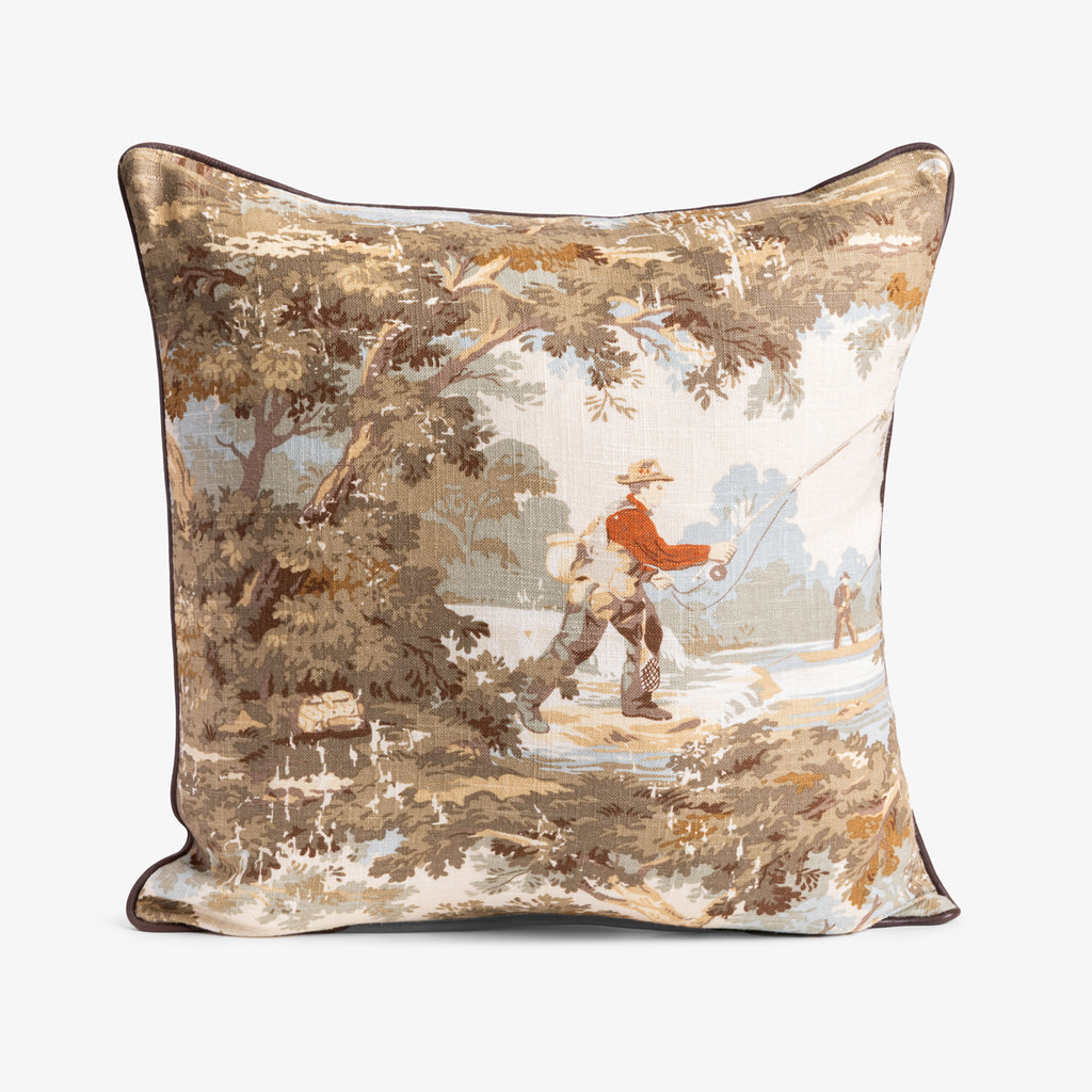 Decorative pillow with a nature-themed design featuring a person fishing.