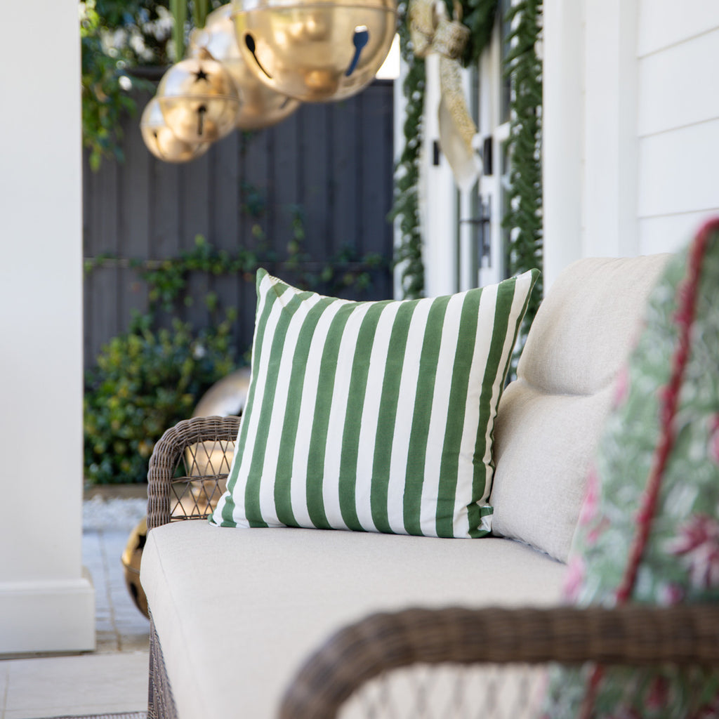 Laya Sage Stripe Cushion Cover Styled on Outdoor Lounge