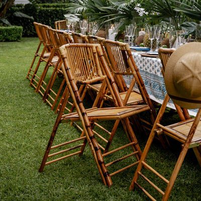 Bamboo Folding Chair Natural Styled outside at Island Dining Table