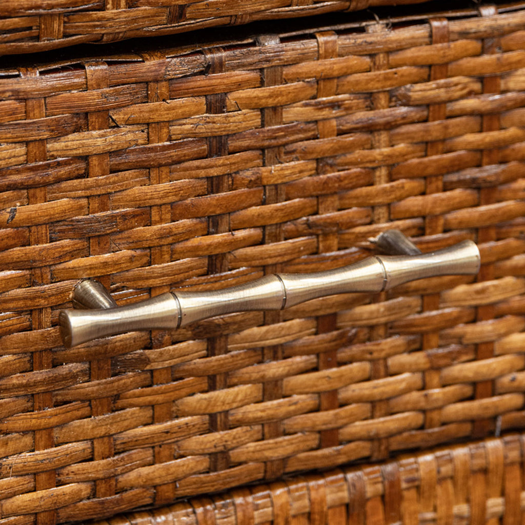 Close up of a bamboo handle on rattan drawer.