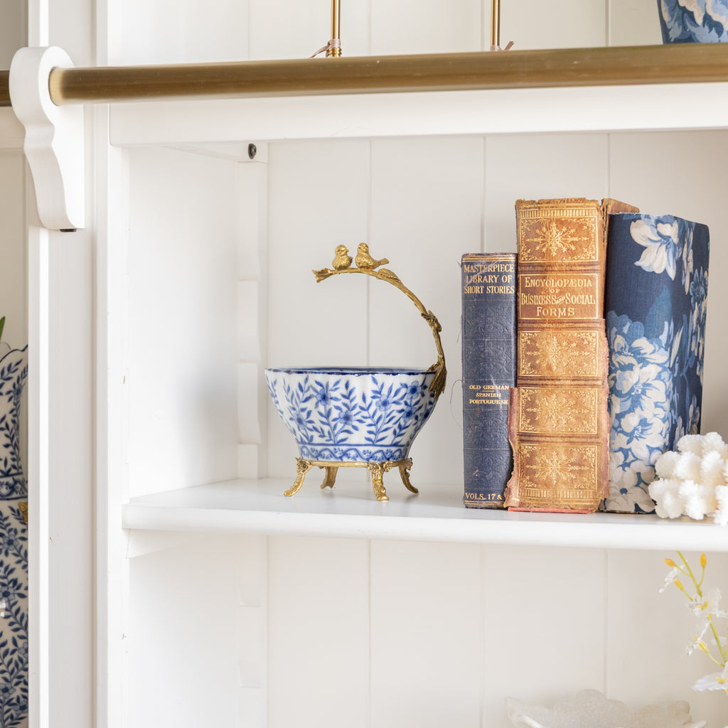 Barclay Blue Bowl With Bird Handle tyled on Bookcase with Books