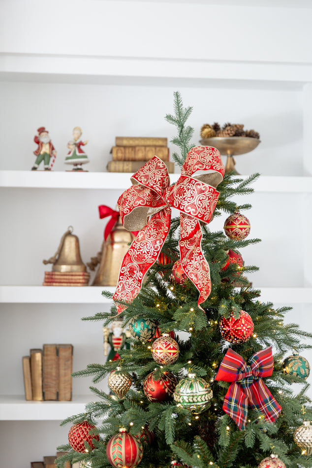 Vail Christmas Tree Topped with Red Velvet Ribbon tied in Bow and Green and Red Baubles