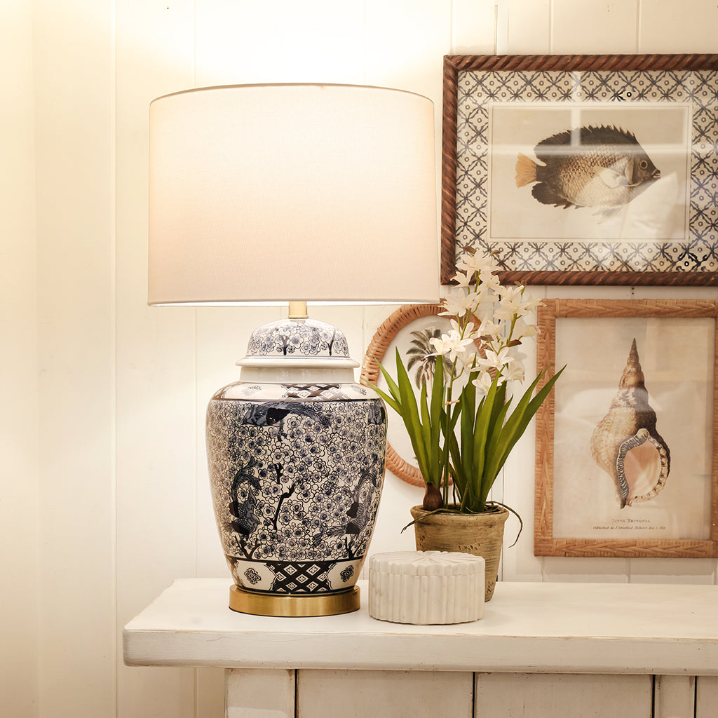 Blue and White Chinoiserie Style lamp Styled on Cabinet with Decor