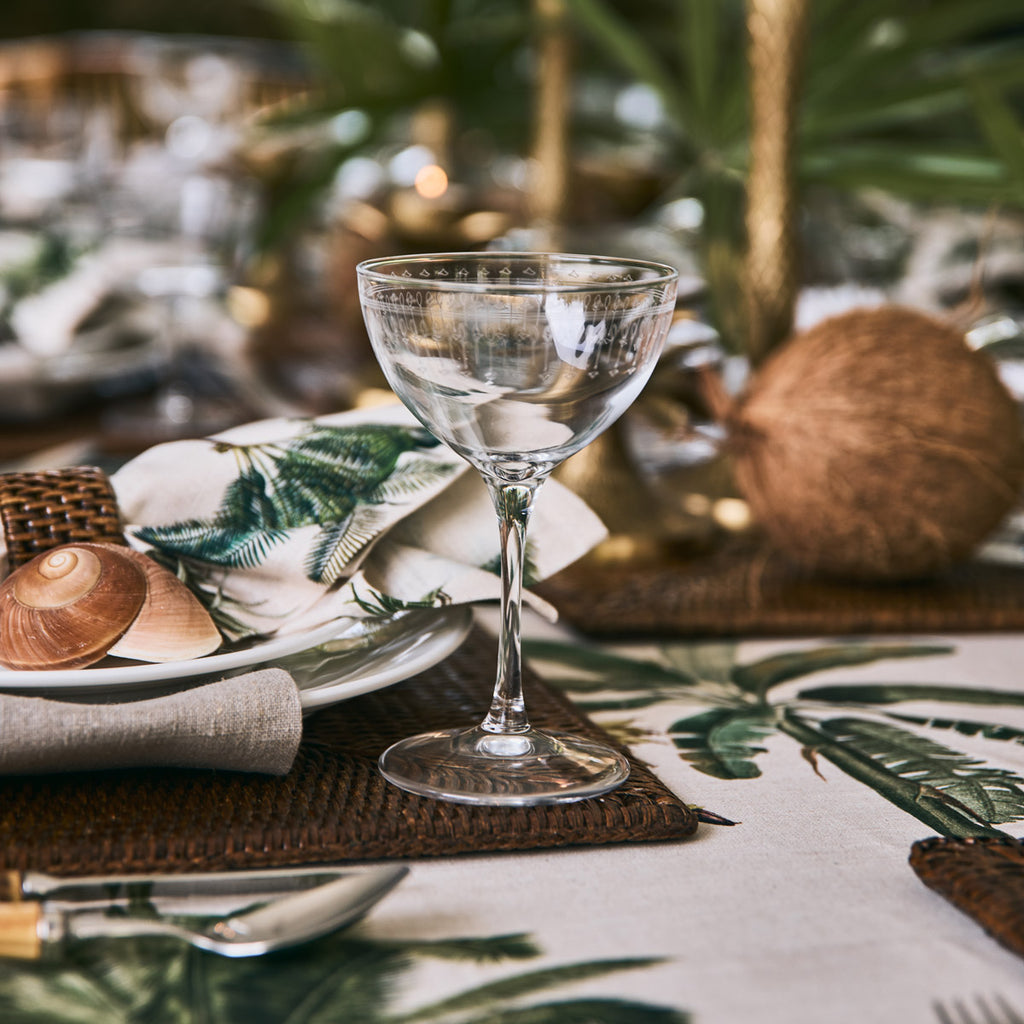 Bormioli Rocco Art Deco Martini Glass Styled On A Table with palm tree print table linens.