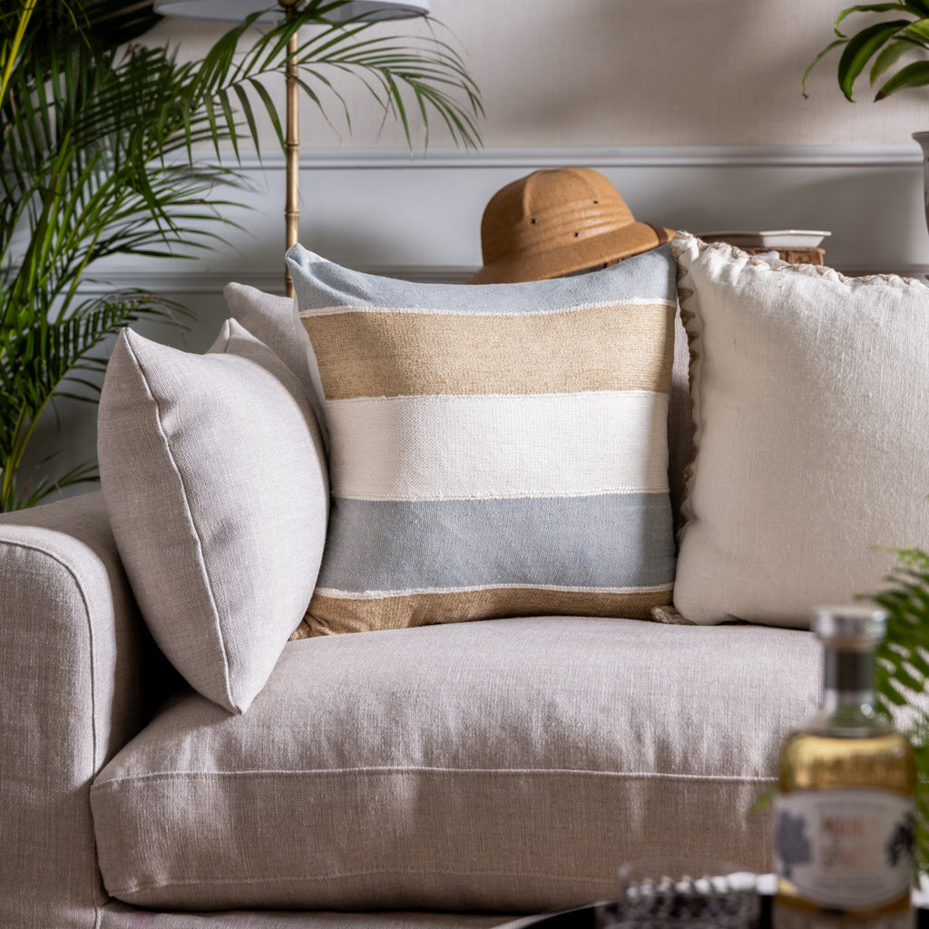 Dune Natural & Light Blue Stripe Cushion Cover styled on Sofa