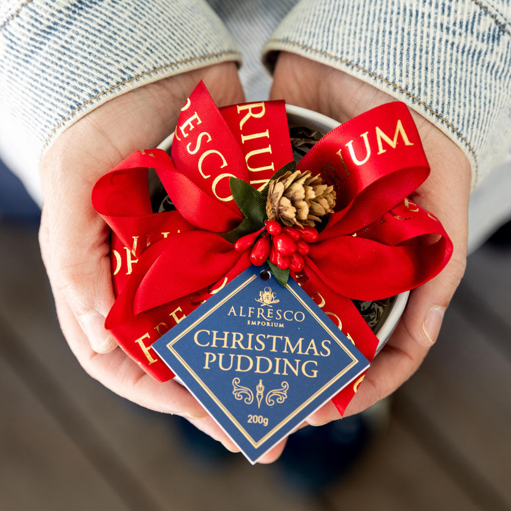 Person holding Dynasty Blue & White Christmas Pudding 2026