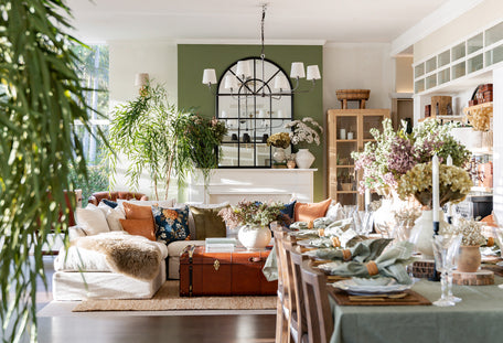 Rustic style living and dining room with leather coffee table.