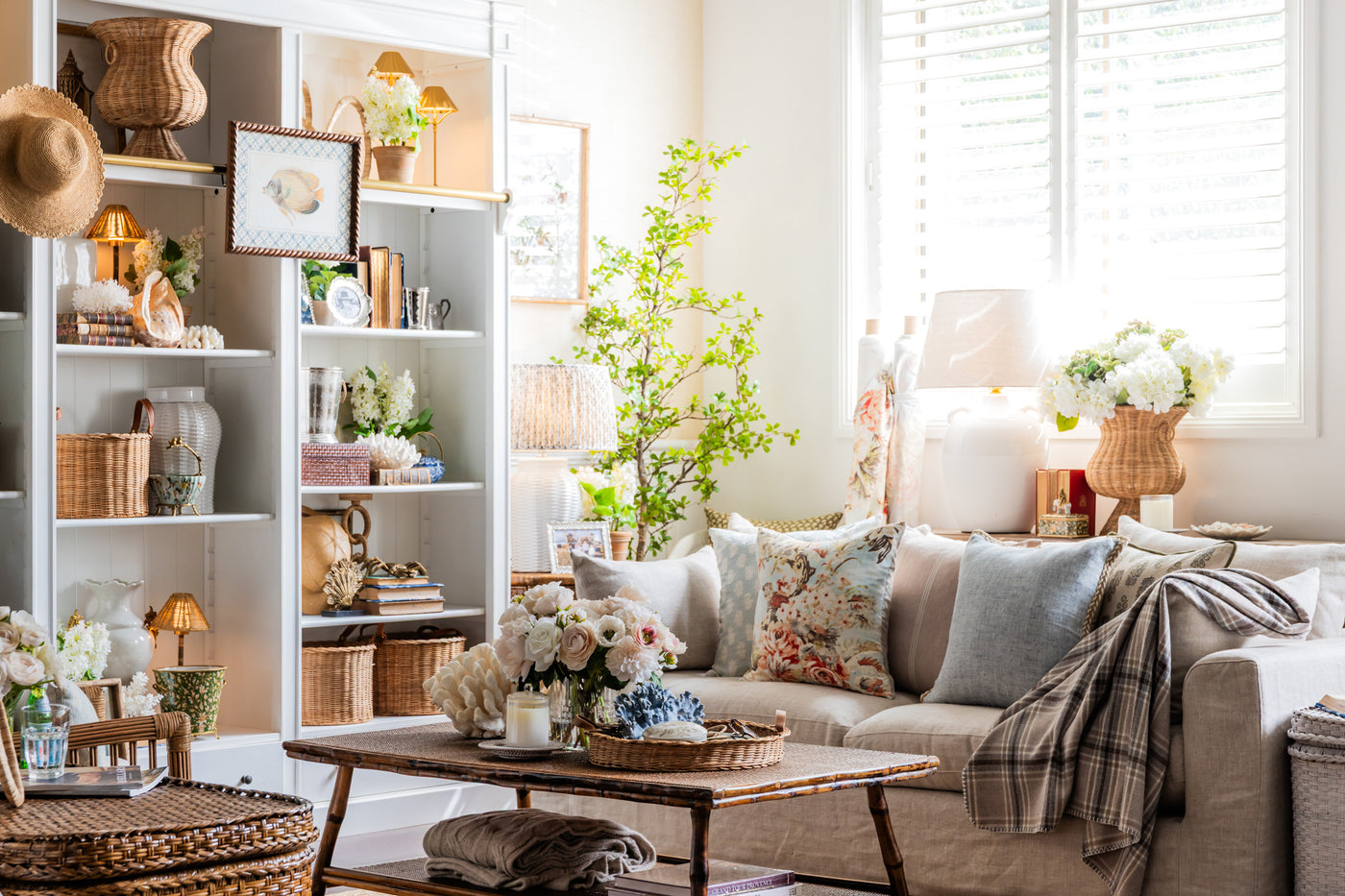 Cozy living room with a beige sofa, coffee table, and decorative items.