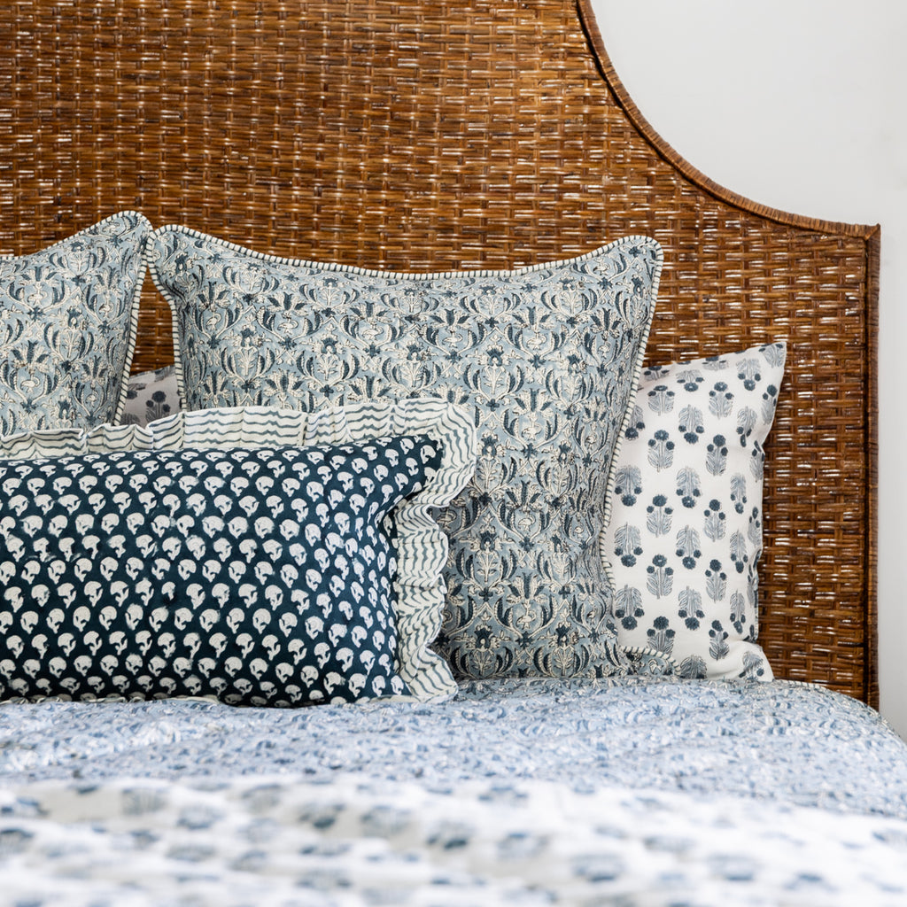 Estelle Bedding Styled on Bed with Brown Rattan Headboard