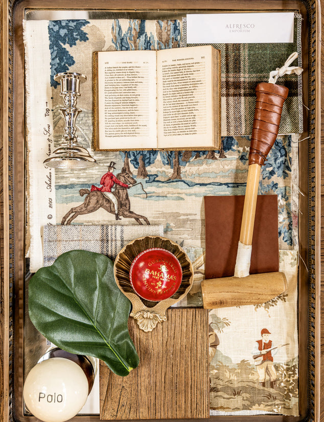 Decorative flat lay with vintage elements including a book, trophy, and sports equipment.