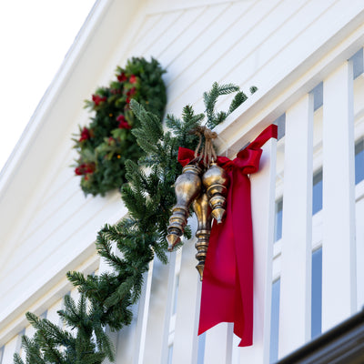 Giant Long Metal Hanging Ornaments (Gold) Styled on Railing Outside with Garland