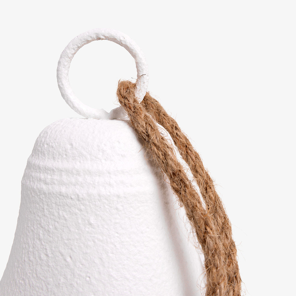 White bell with a rope on a white background Close Up