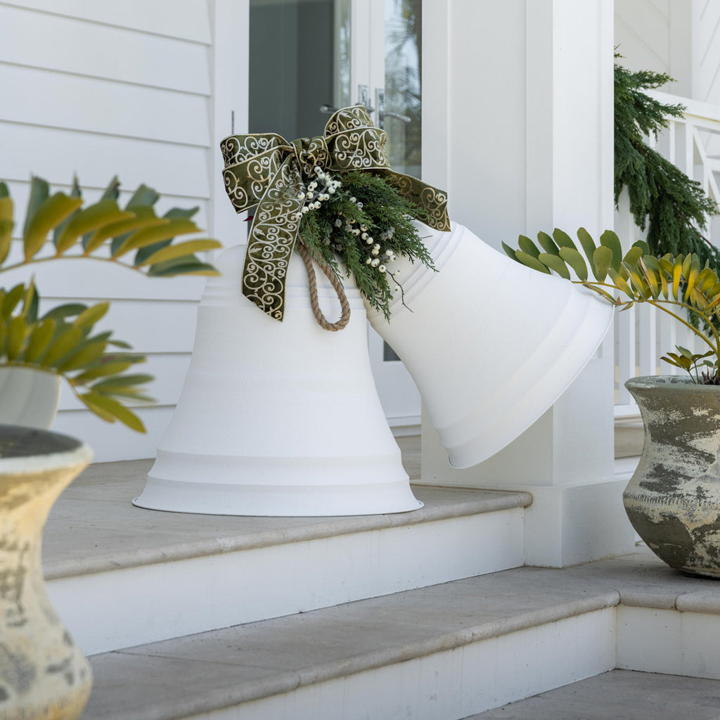 Giant Metal Hanging Bells (White) Tied together with ribbon, foliage and white berries.