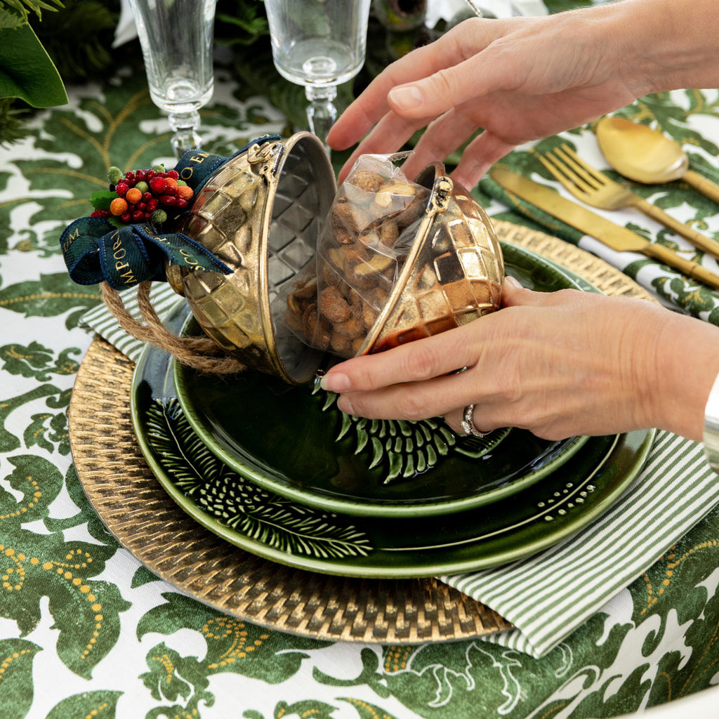 Gold Gift Bauble with Cashews styled open on a place setting.