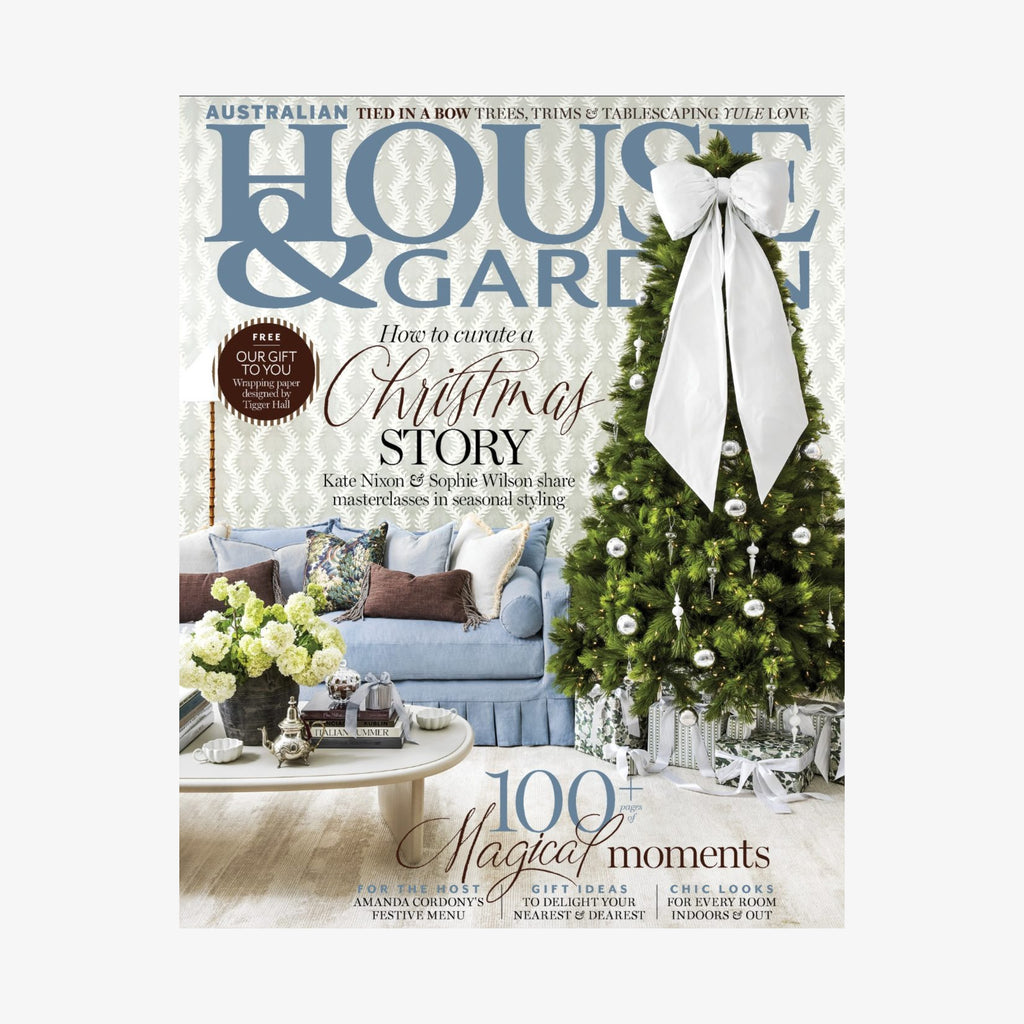 Magazine cover titled 'House & Garden' featuring a Christmas theme with a decorated tree and living room.