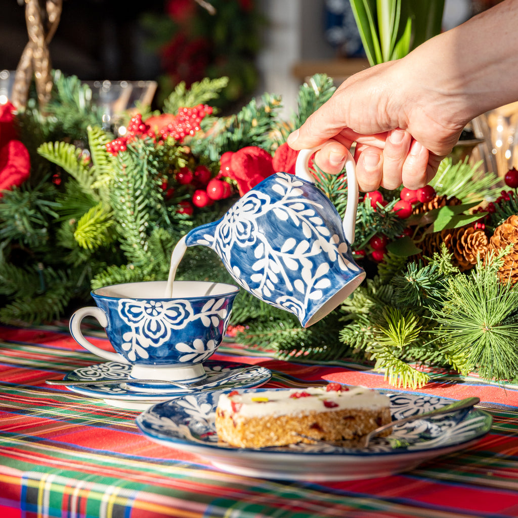 Indigo Bloom Floral Jug Styled on Table Pouring Milk into Tea Cup