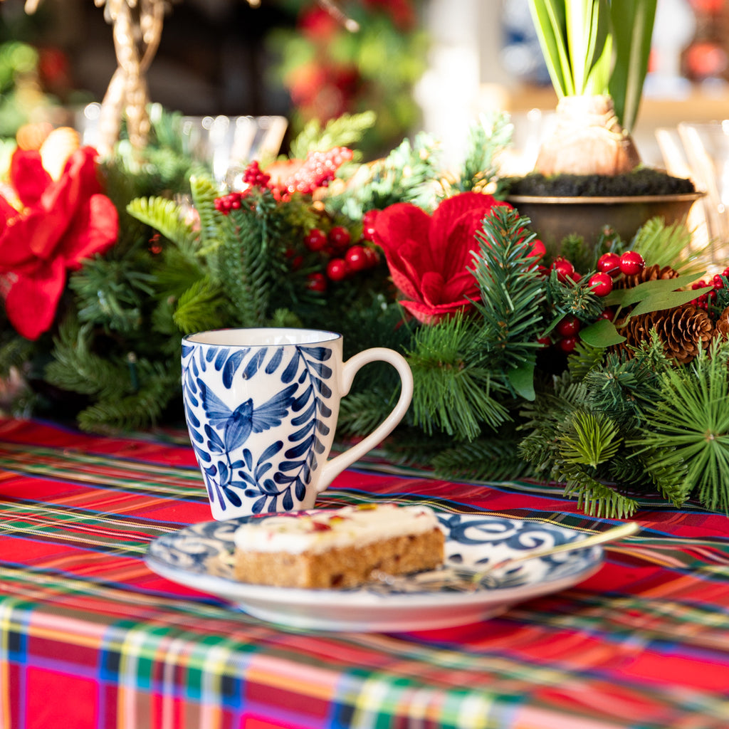 Indigo Sky Bird Mug Styled on Christmas Dining Table with Cake on Plate in Front