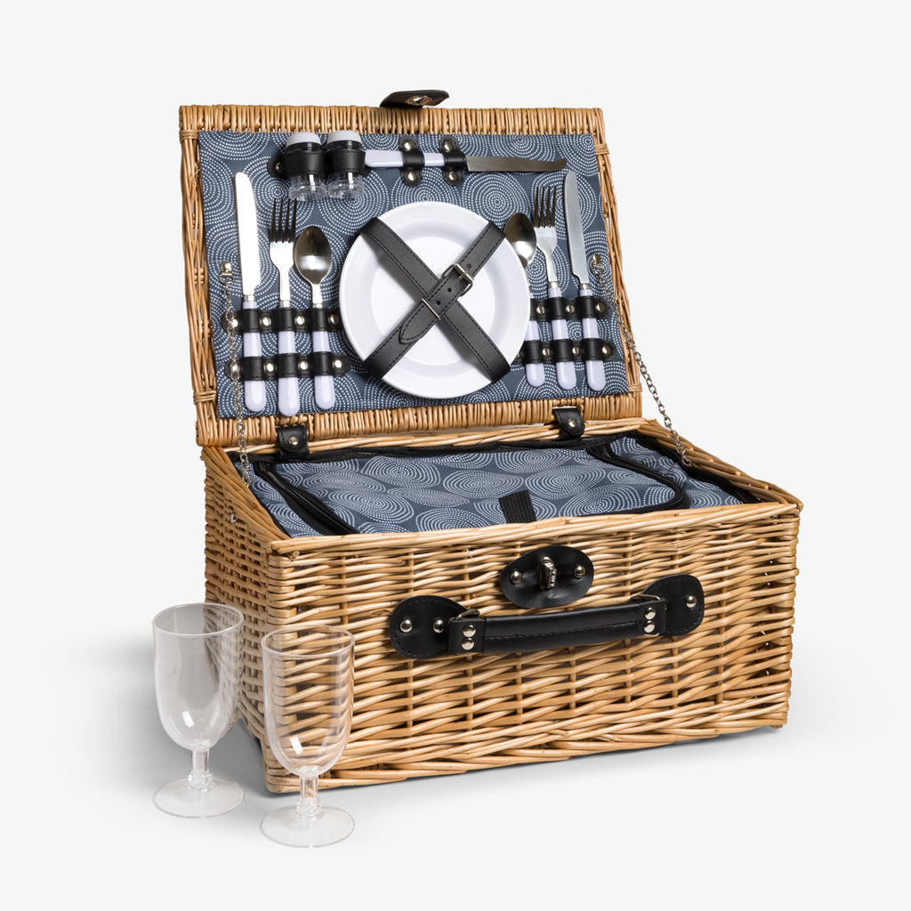 Picnic basket opened to reveal included picnic set