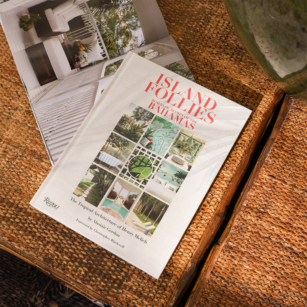 Island Follies Book Styled on Rattan Table with Palm Shadow