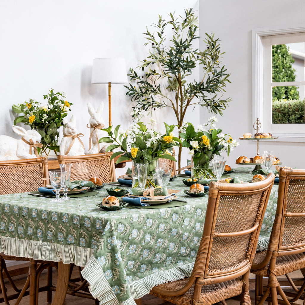 Laya Floral Ruffled Tablecloths Styled on Easter Table with Bamboo Dinnerware and Antigua Dining Chairs