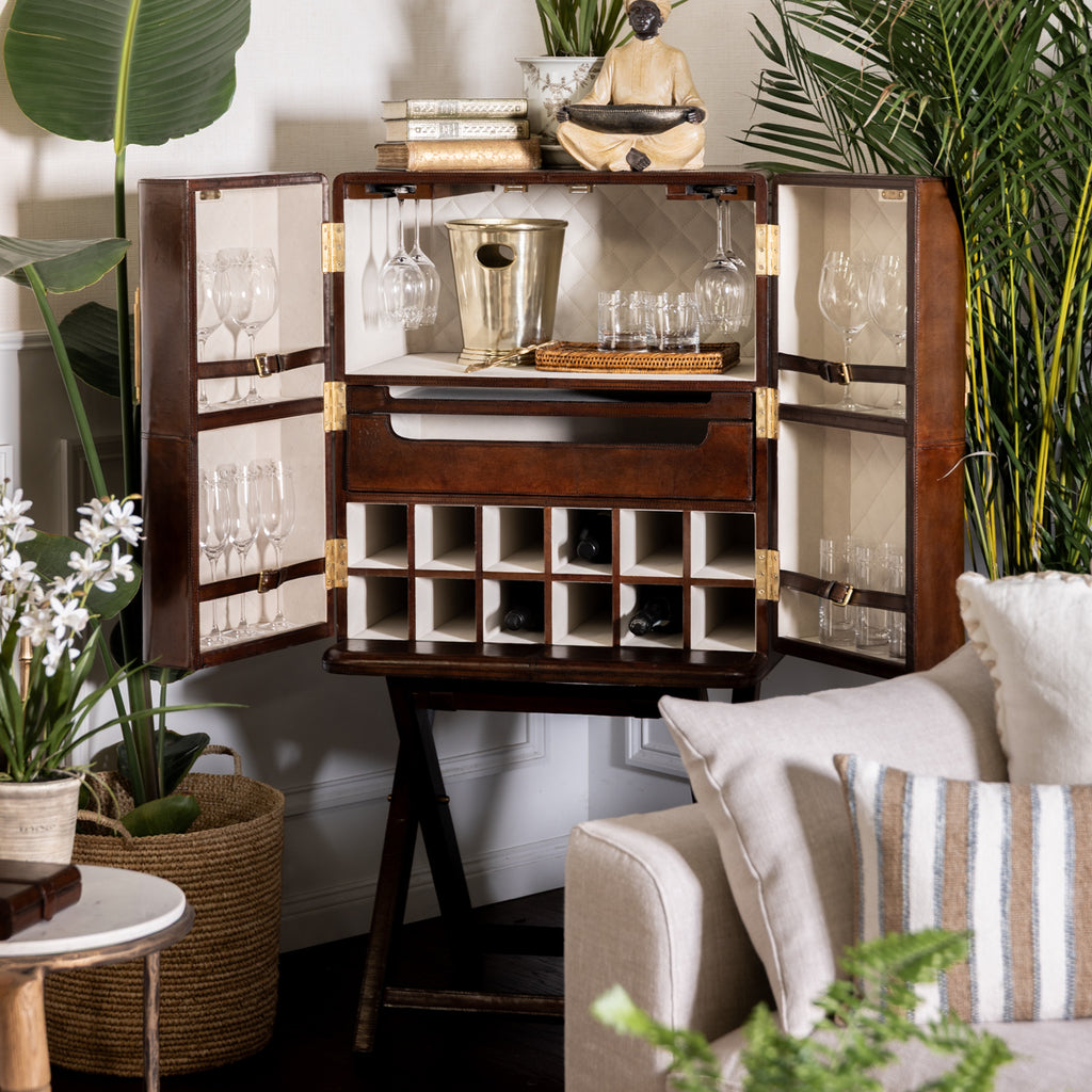 Leather Bar Stand with Gold Handles Styled in Living Room with Palms and Drinkware in Bar