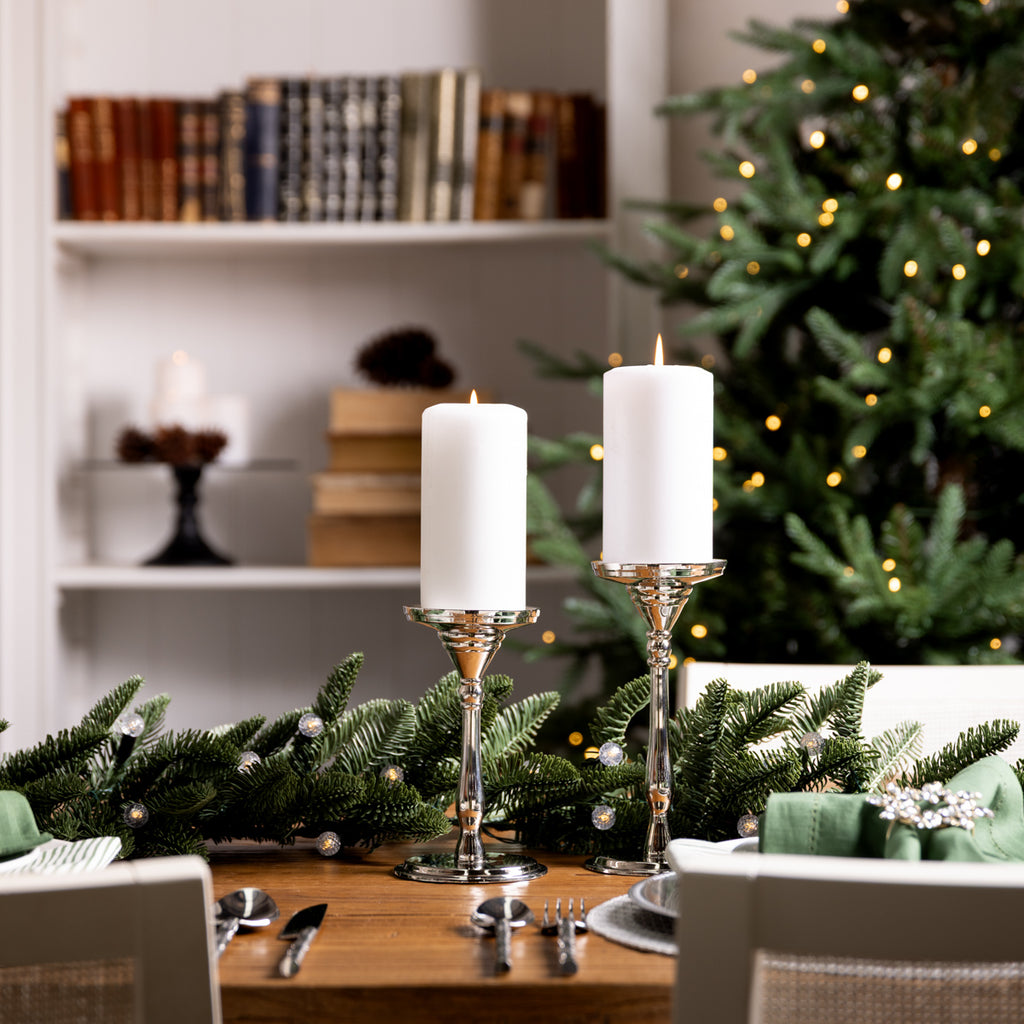 Candle holders on a table.
