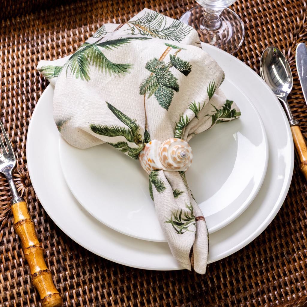 Shell Napkin Rings Set Of Four (Natural) Styled on Rattan with Palm Tree Napkin