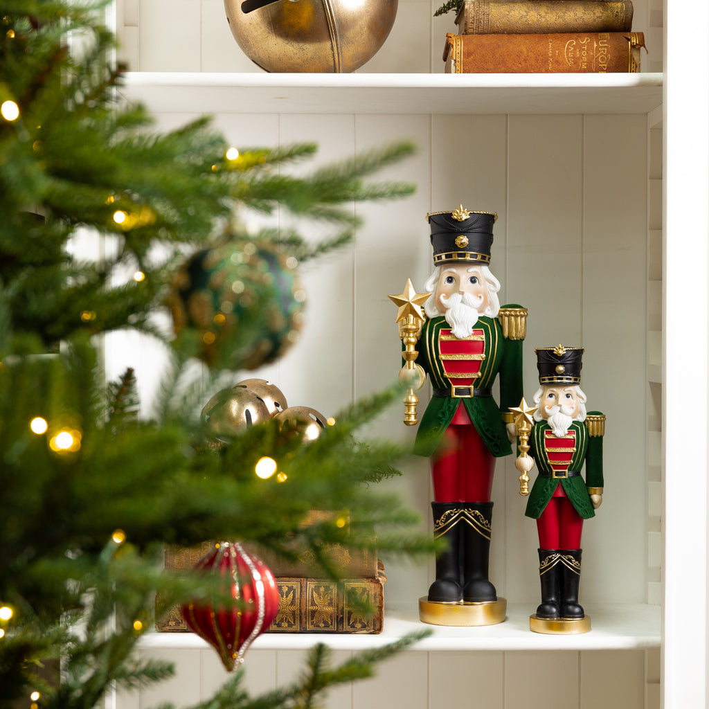 Nutcracker With Star Ornaments Styled on Bookcase