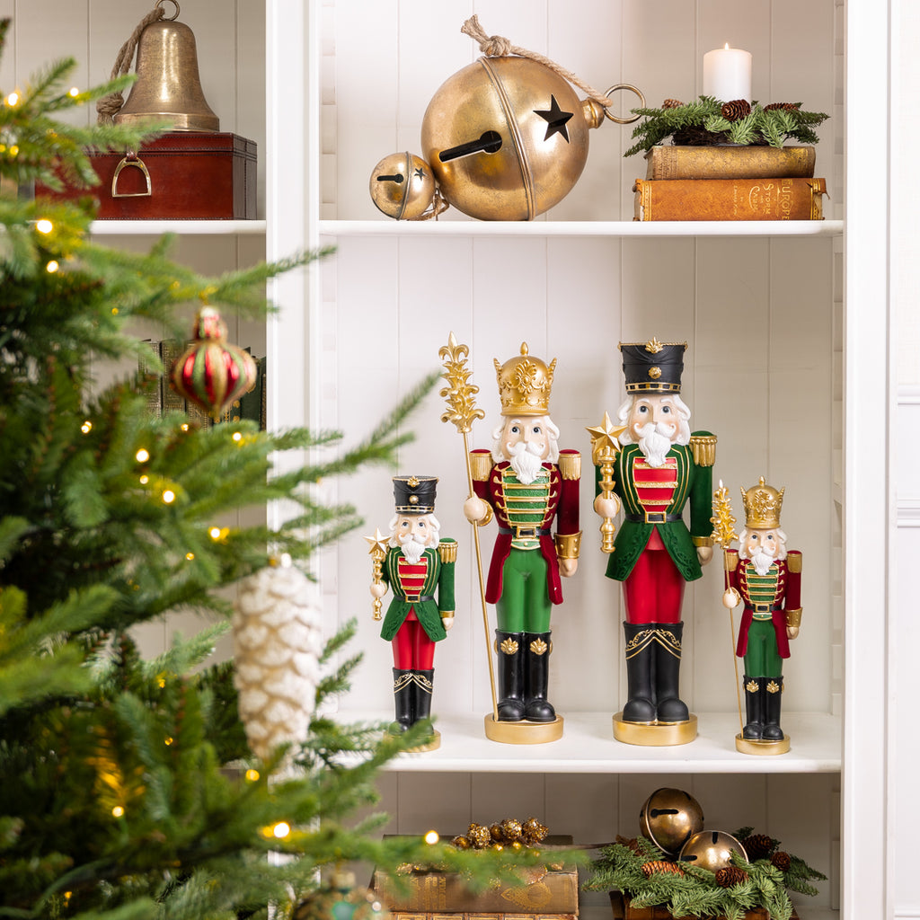 Nutcracker With Star Ornaments Styled in group on Bookcase
