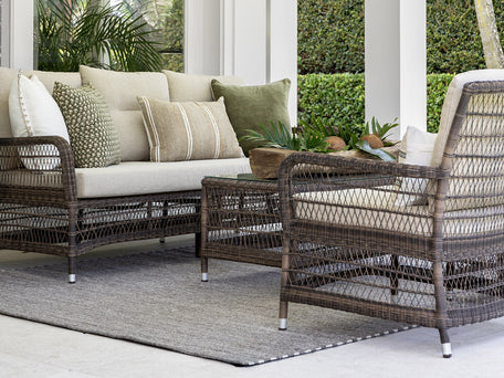 Woven outdoor sofas with coffee table.