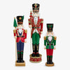 Three giant colourful nutcrackers on a white background.